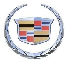 Cadillac logo featuring a shield with colored stripes and a silver wreath surrounding it.